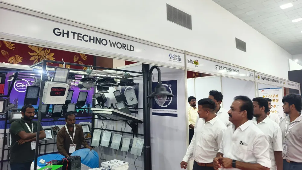 Visitors walking past CNC machines at the GH Techno World stand